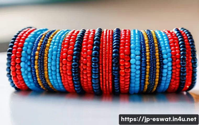 에스와티니에서 전통 공예품 구입하기 - A vibrant close-up of traditional Swazi beadwork bracelets, showcasing intricate patterns made from ...